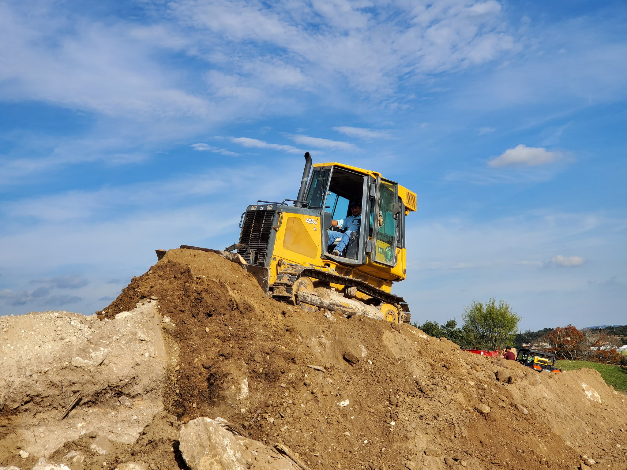 King Villages operator shaping earth with a bulldozer