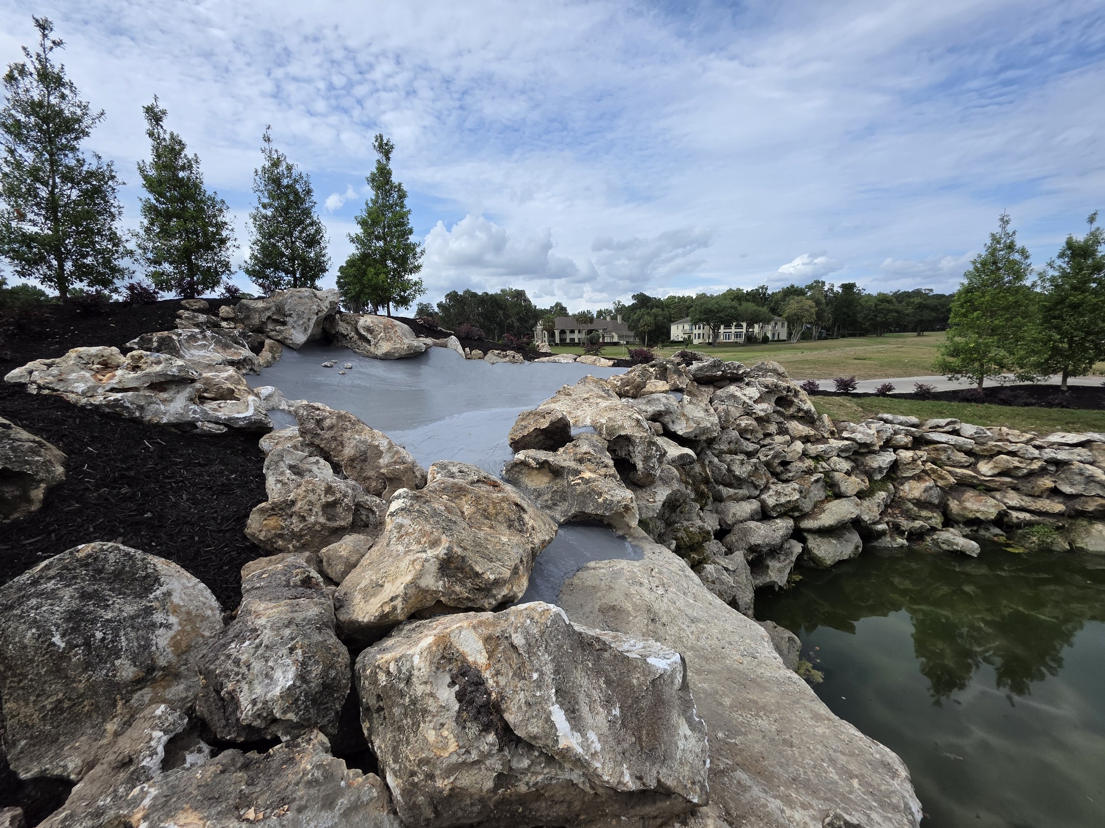 Stone installation surrounding a water feature