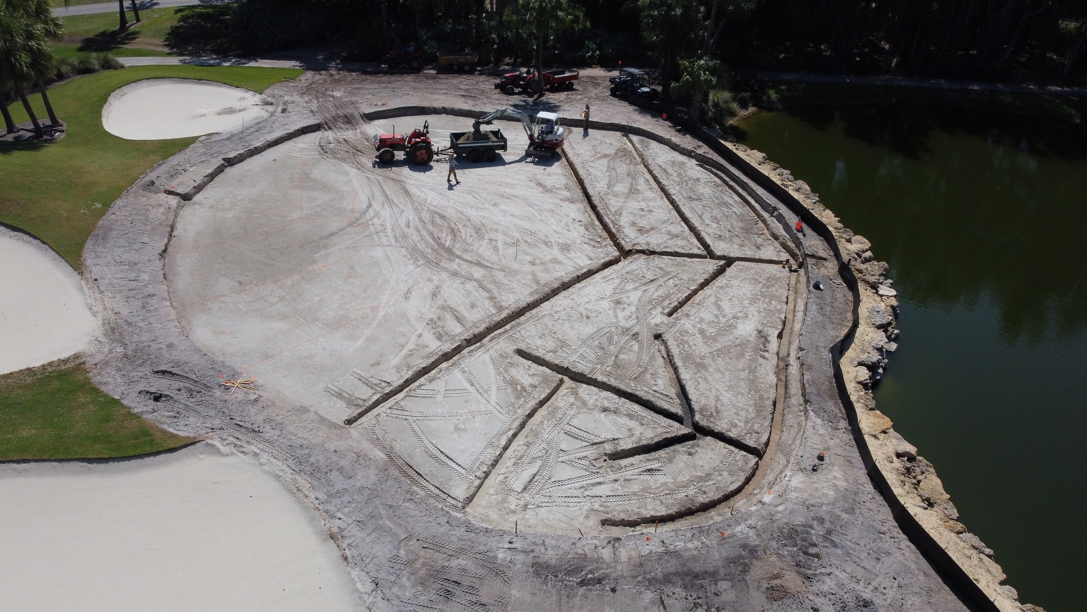 Aerial view of golf feature construction beside water at Orchid Island Golf & Beach Club