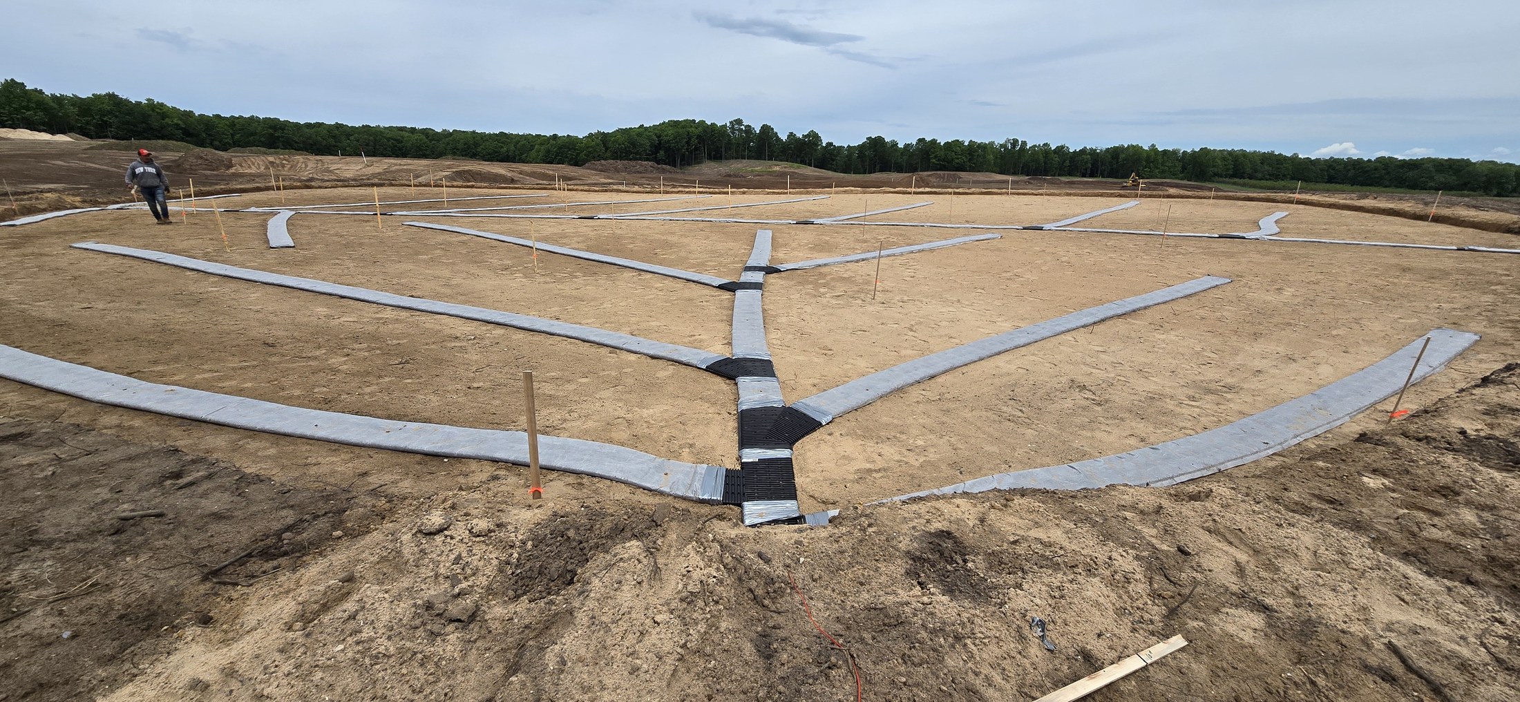 Geometric drainage installation across a golf feature at The Dozen at Arcadia Bluffs