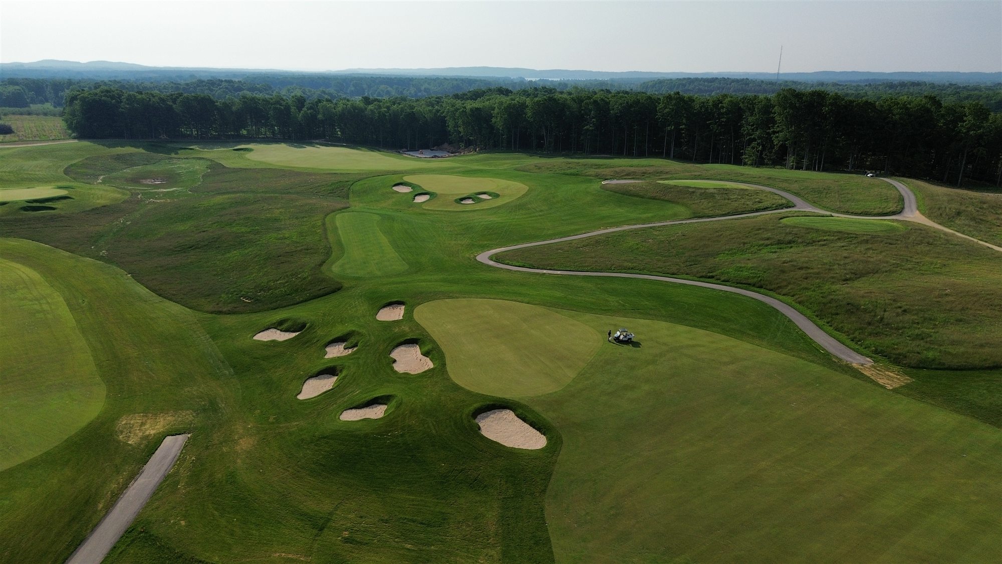 Aerial view of completed greens and bunkers at The Dozen at Arcadia Bluffs