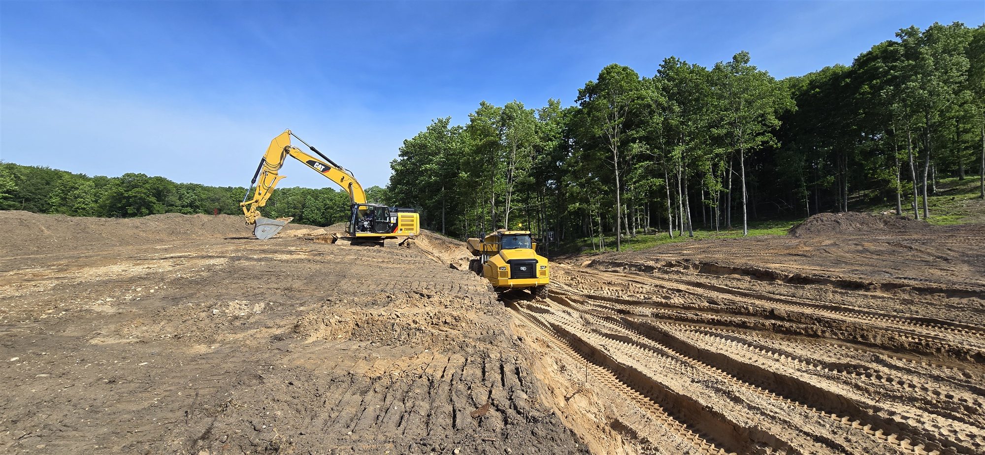 Earthmoving equipment during construction at The Dozen at Arcadia Bluffs